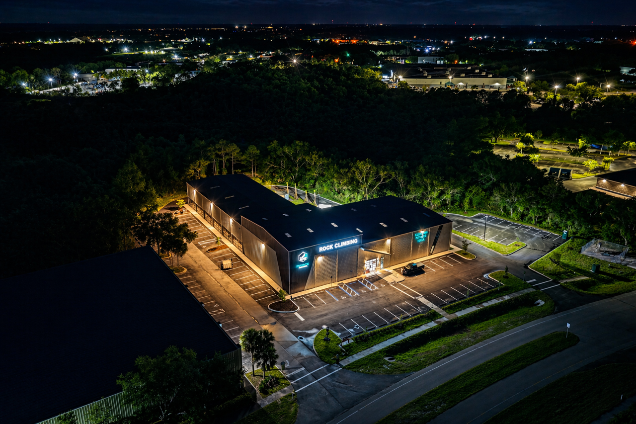 HomePage 3 Night aerial drone shot of HexRock climbing gym facility built by Holliday Group